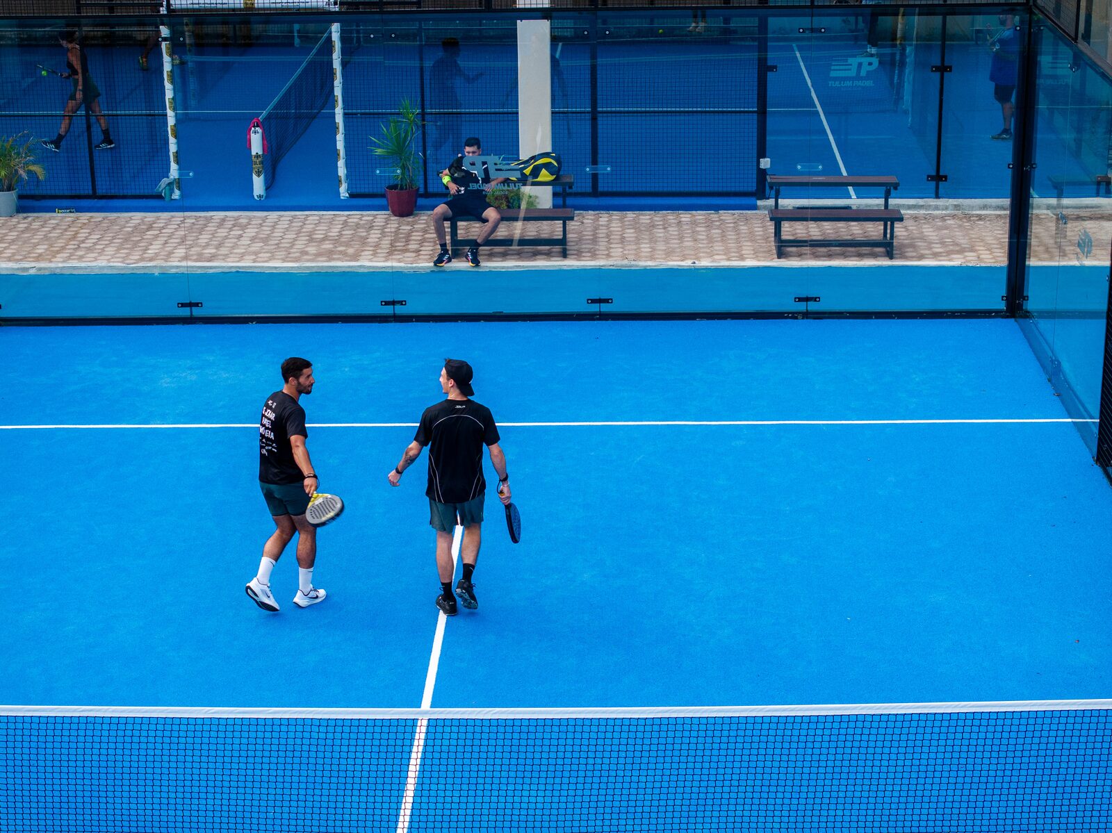 Aerial view of two players on a Tulum padel court